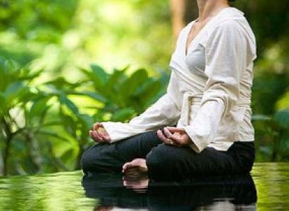 Woman meditating outside
