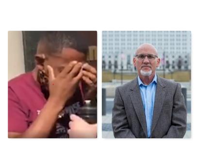 Man with head in hands, another man posing