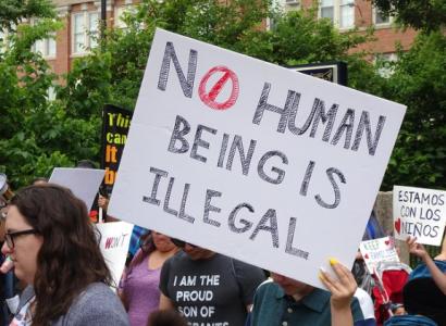 No Human Being is Illegal sign