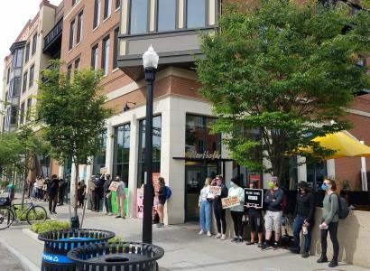 People protesting outside a building