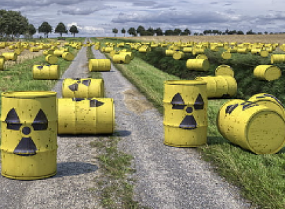 Barrels with radioactive symbols on the ground