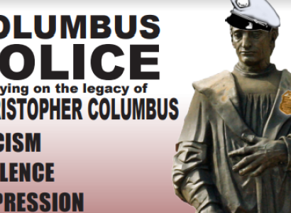 Columbus statue wearing a police hat and badge