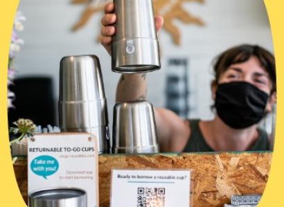 Man with cup at coffee shop