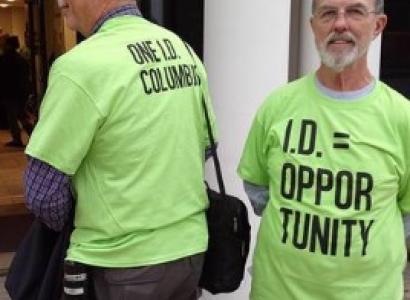 Two men wearing OneID T-shirts