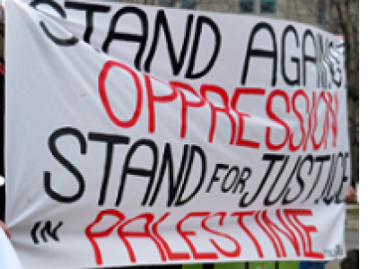 Banner reading Stand Against Oppression Stand for Justice in Palestine