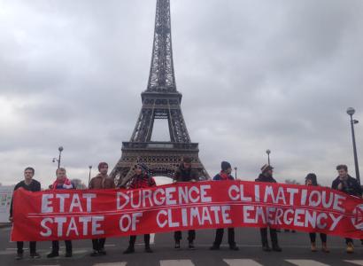 Eiffel Tower with big climate justice sign in front