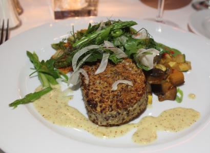 Quinoa and potato cake with fennel salad and roasted vegetables.
