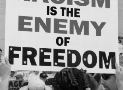 Sign reading Racism is the Enemy of Freedom