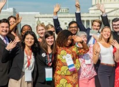 People posing outside capitol building