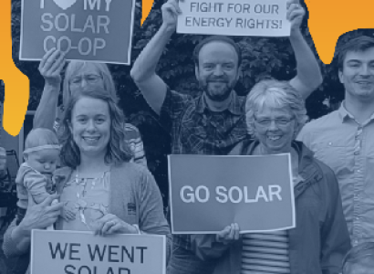 People holding signs about solar power