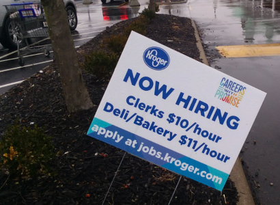Yard sign saying Kroger is hiring people at $10 and $11 dollars an hour