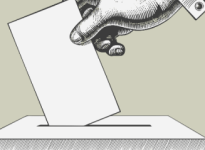 Hand putting ballot in box