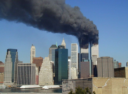 Plumes of smoke billow from the eWorld Trade Center towers in New York City after a Boeing 757 hits each tower during the September 11 attacks