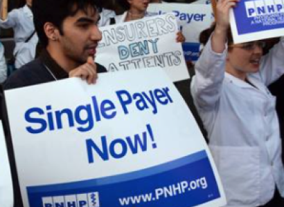 Guy holding Single Payer Now sign