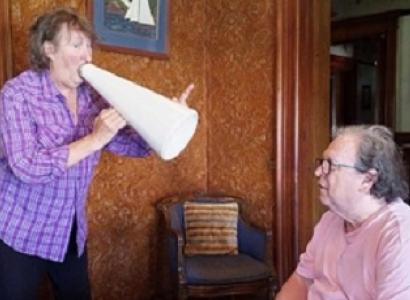 Dan Dougan yelling at Bob through a megaphone
