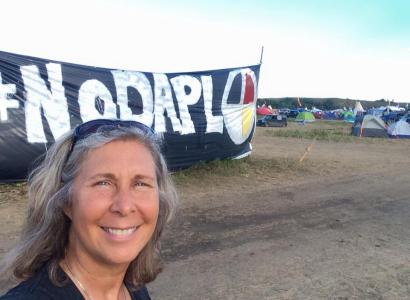 Heidi Detty in front of No DAPL banner