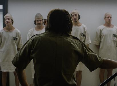 Policeman standing infront of a lineup of criminals