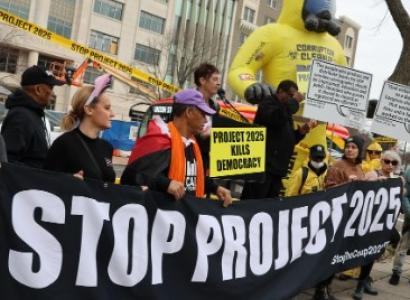 Protestors with Stop Project 2025 banner