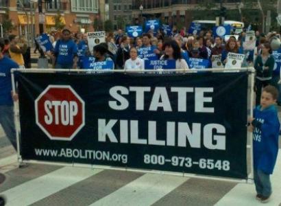 People marching with sign Stop State Killing