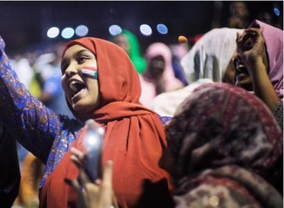 Woman shouting in a crowd