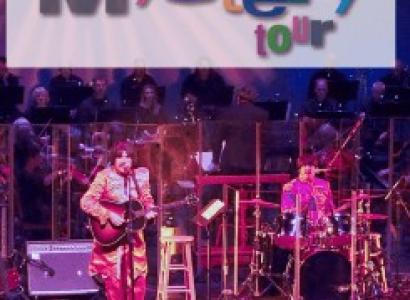 Band on stage under sign saying Classical Mystery Tour