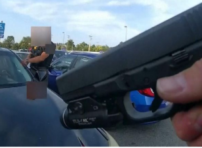 Gun aimed at car
