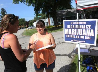 Photo of people with political sign