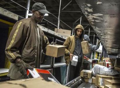 People working with boxes at UPS