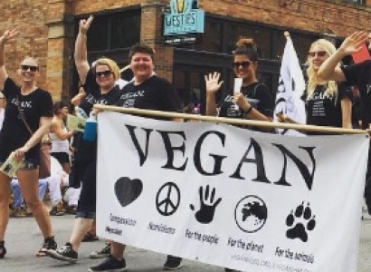 People marching with Vegan banner
