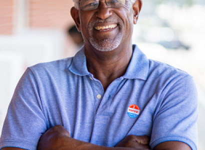 Man with voting sticker on shirt