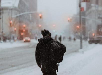 Back of man outside on a snowy street