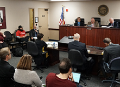 People in what looks like a courtroom
