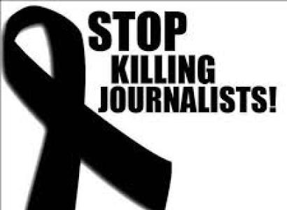 Black ribbon and words Stop Killing Journalists
