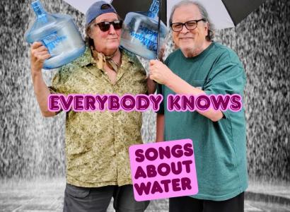 Bob and Dan with an umbrella and water bottles