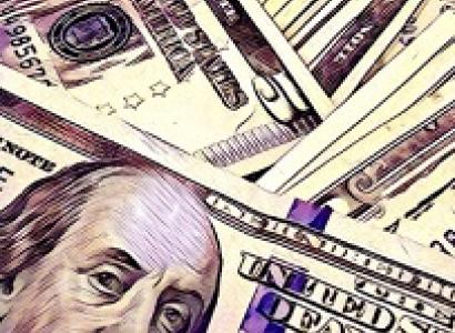 Close up of many dollars scattered on top of each other