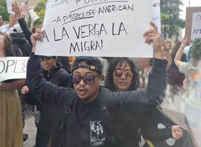 Man holding protest sign