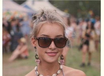 Young woman at outdoor festival wearing a shell necklace