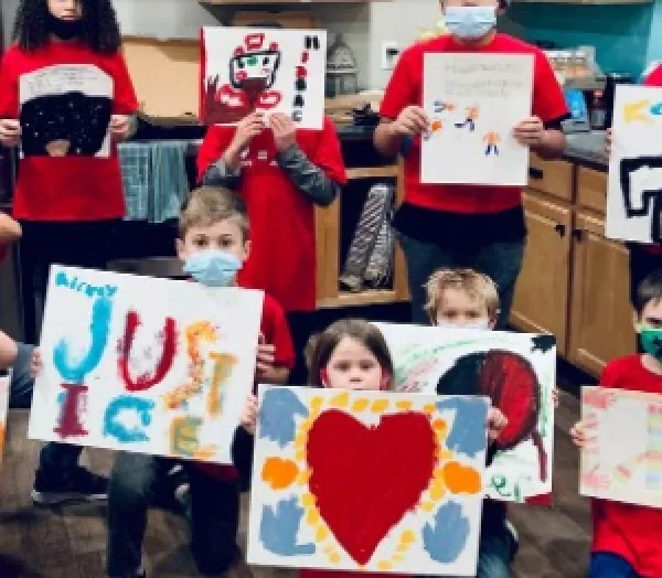 Kids holding signs