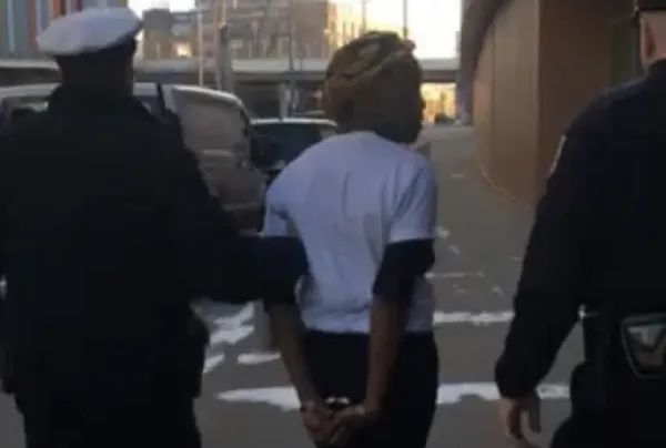 Black woman being arrested