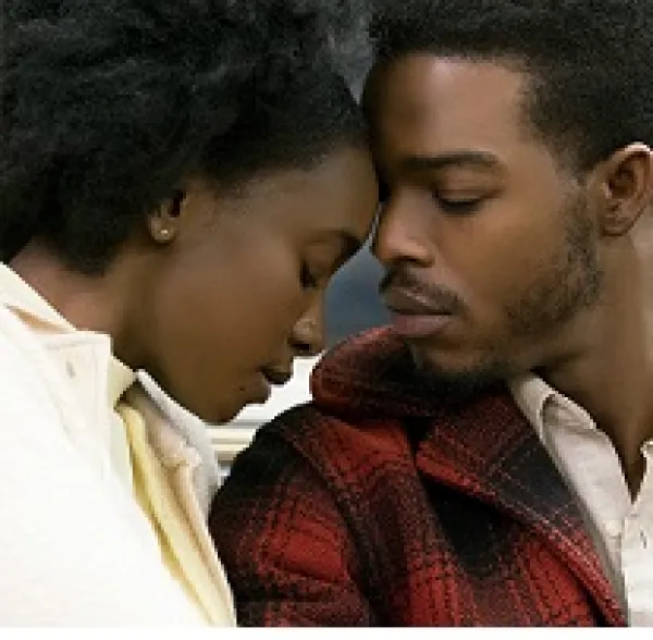 Black man and woman with eyes closed leaning their foreheads against each other