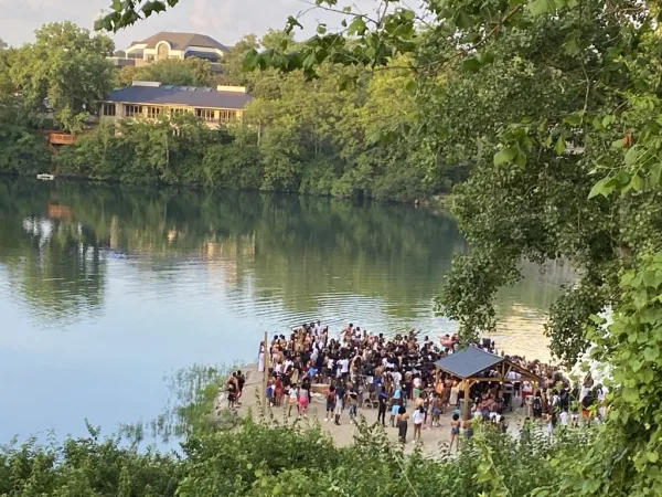 People gathered by a quarry