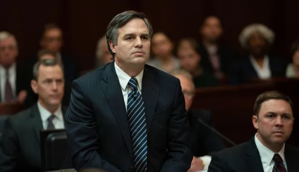 White guy in a suit looking serious