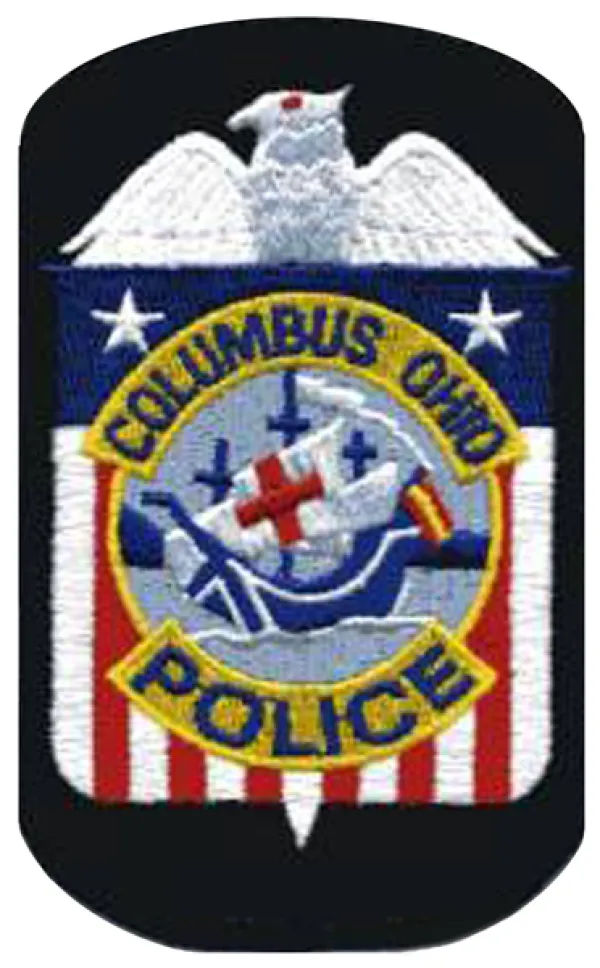 Badge with Santa Maria in center and red/white/blue background saying Columbus Ohio Police