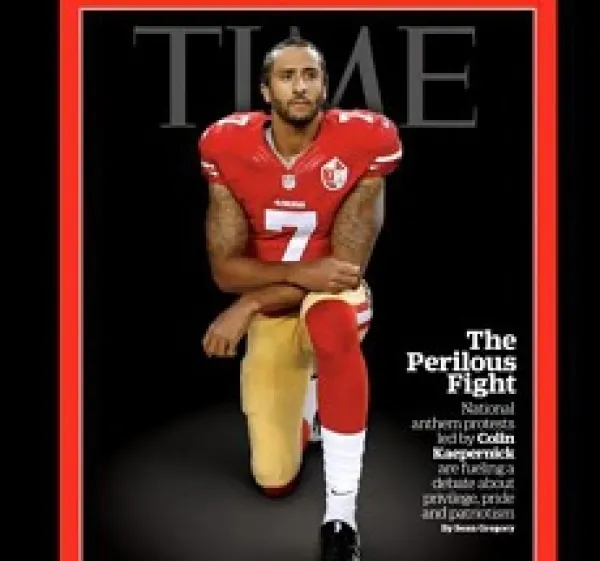 Magazine cover with word TIME at the top and football player in red and gold jersey kneeling and facing the camera and words about him - Colin Kapernick