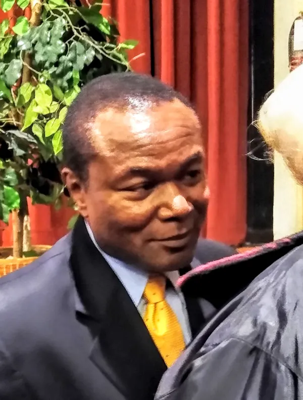 Black man deep in conversation