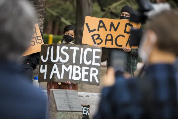 Protestors holding signs