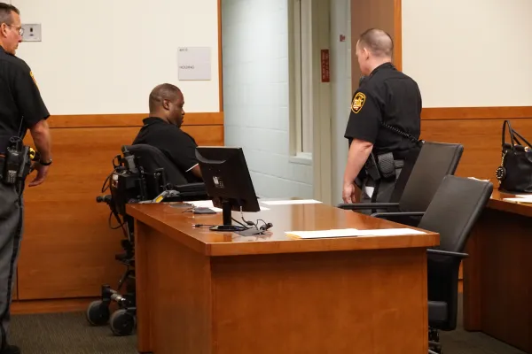 Man in wheelchair in police station