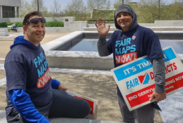Guy with Fair Districts sign