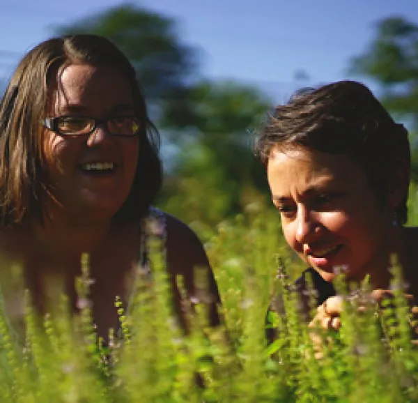 Two young women out in a field