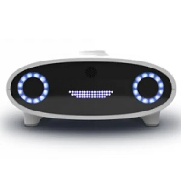 Black faced white bordered device like a radio with two round knobs facing out that look like eyes and lines in the middle that look like a mouth